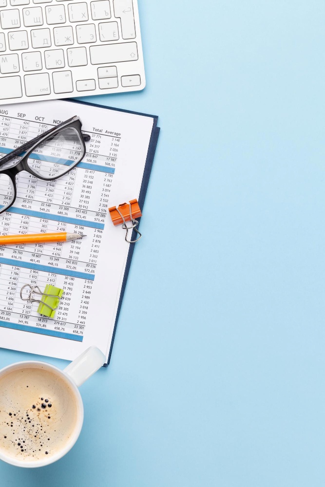 Overhead shot of desk featuring a financial report