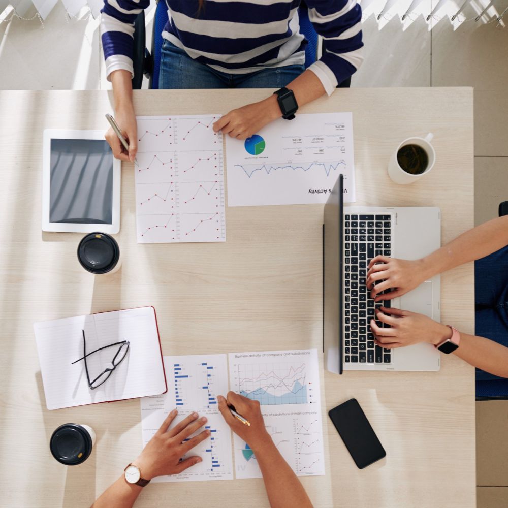 Overhead shot of business reports being analysed
